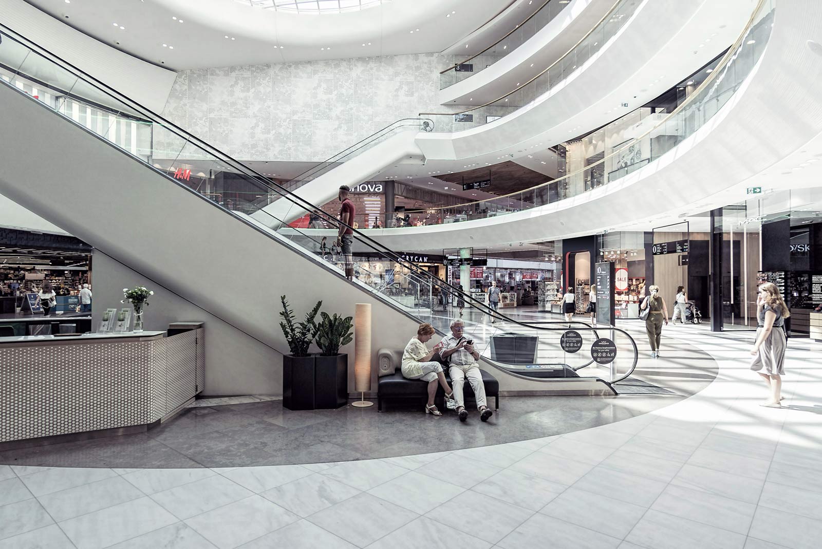 Shoppers inside a modern shopping mall