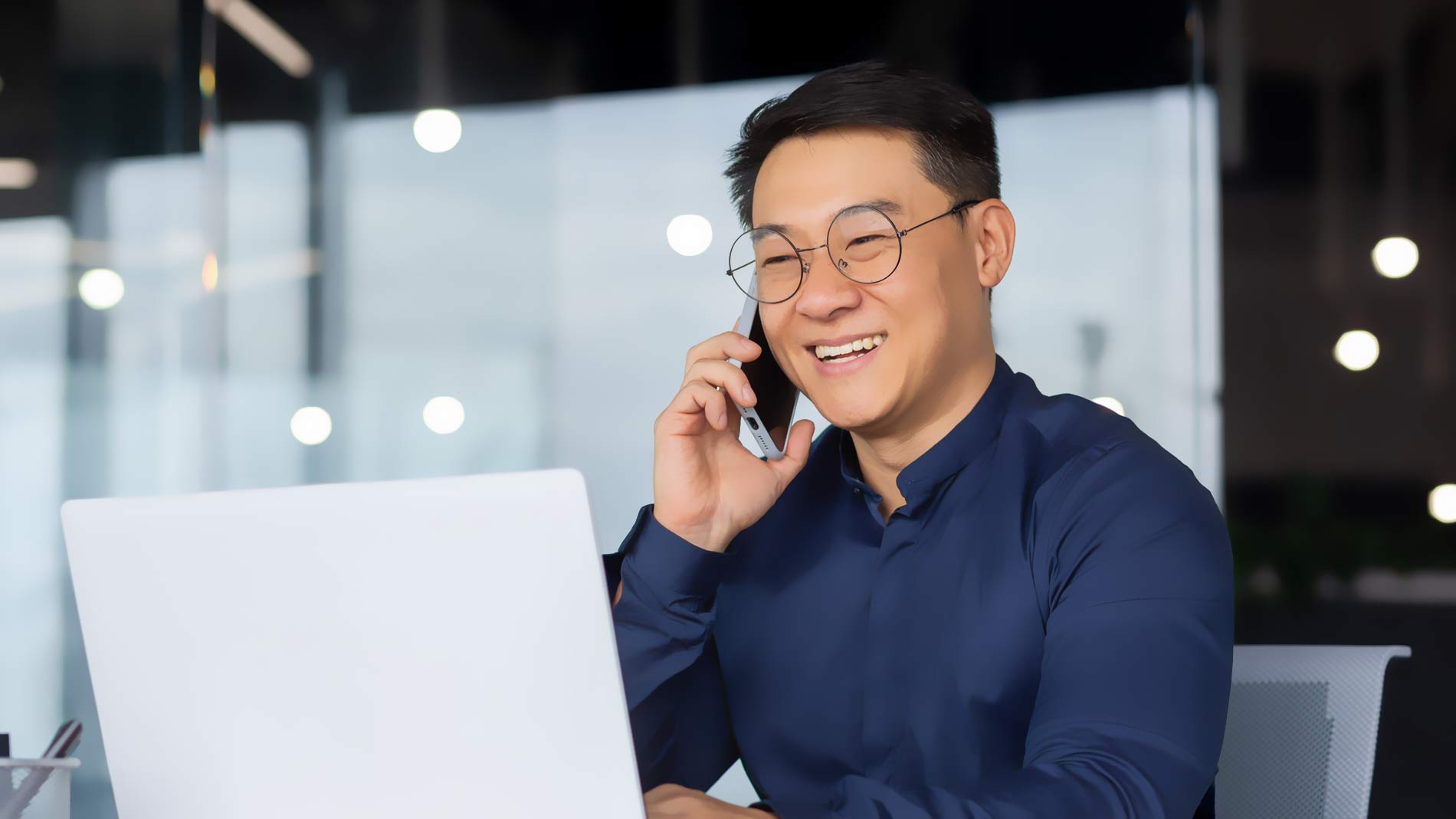Smiling businessman making a phone call