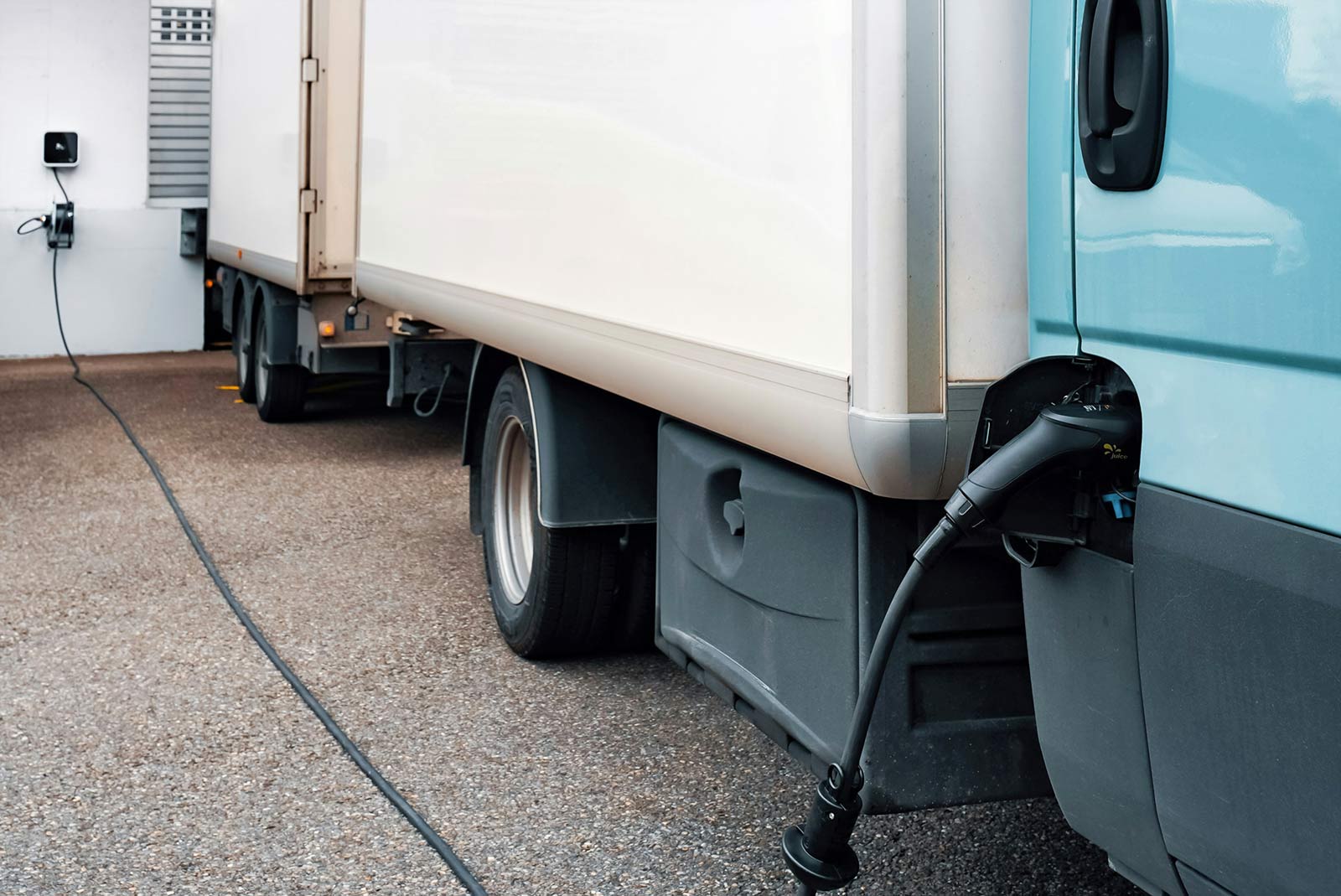 EV truck connected to a charging point